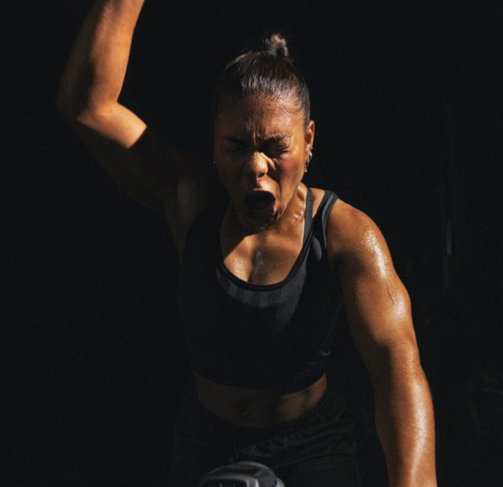 Les Mills Sprint instructor sweating with open mouth