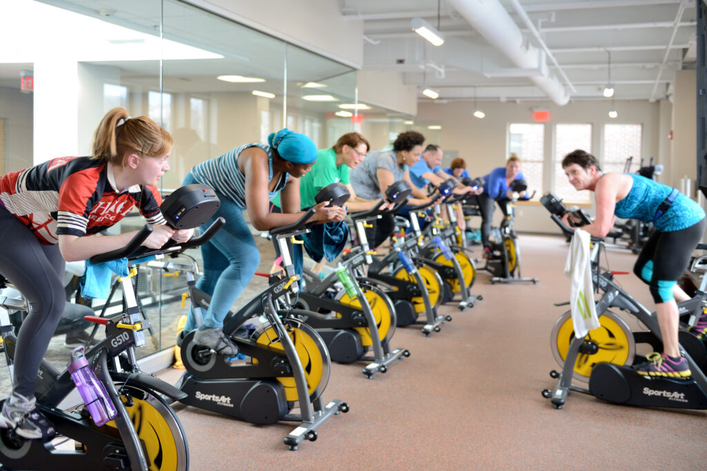 8 people on sportsart indoor bikes in a cycling studio