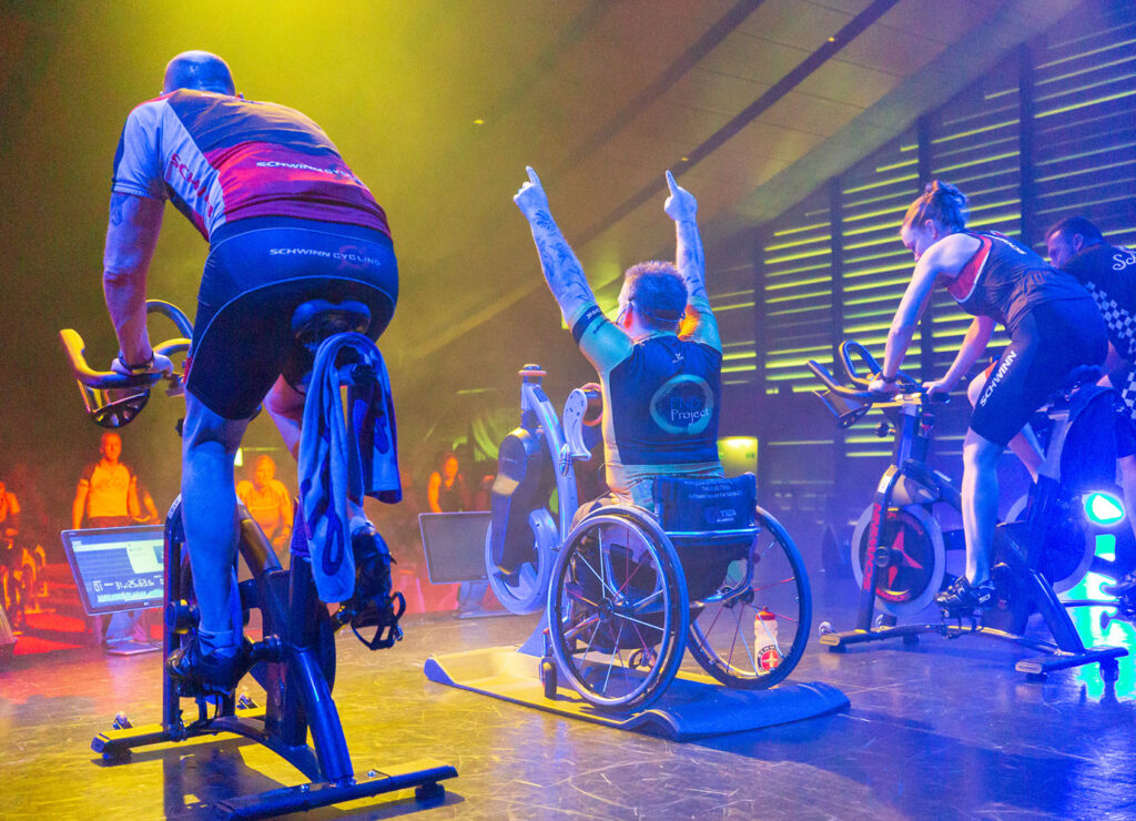 spinning instructor in wheel chair