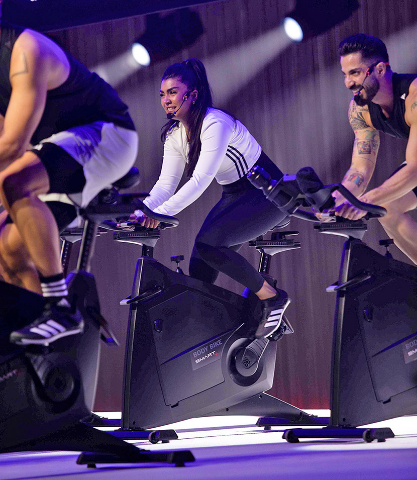 crew on stage on les mills rpm100 live event in los angles